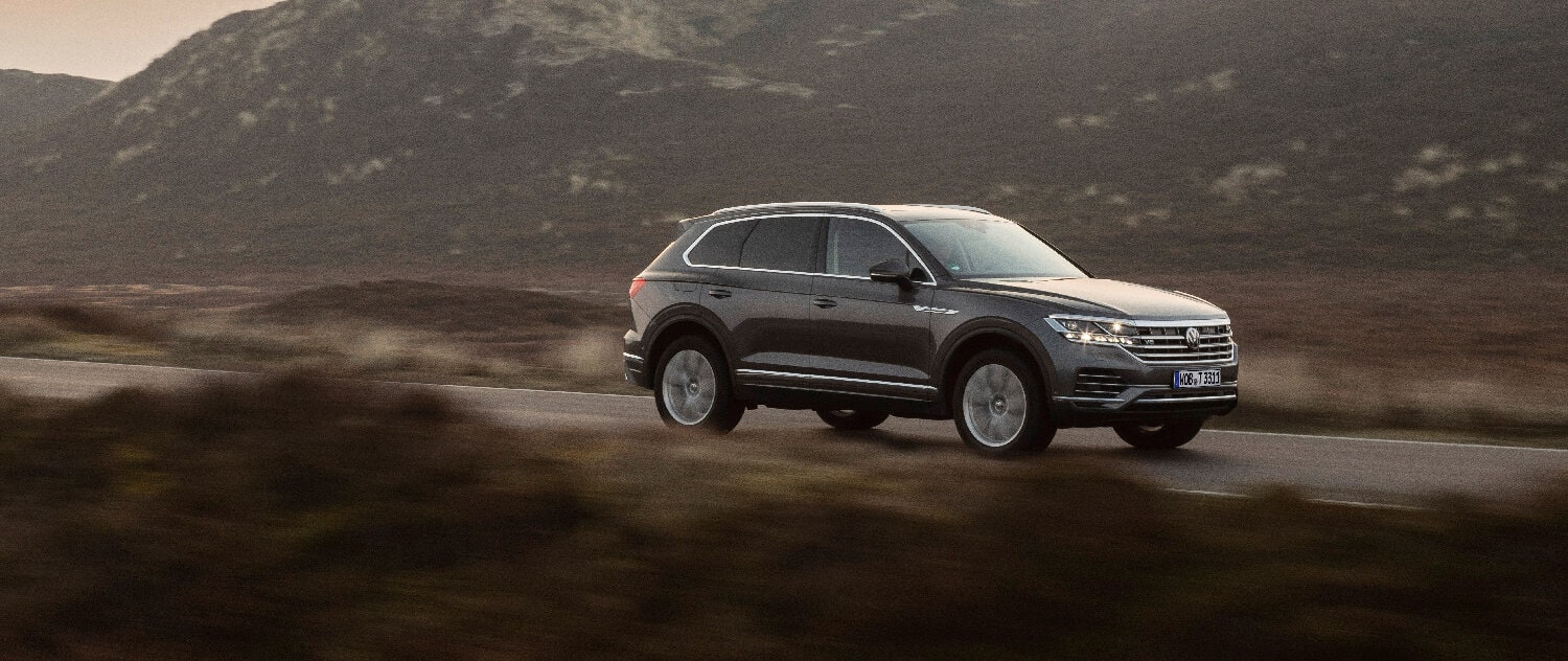 Luxury car on a scenic road